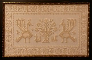 Tapestry with a flat wenge-finish frame featuring raised silver decoration.